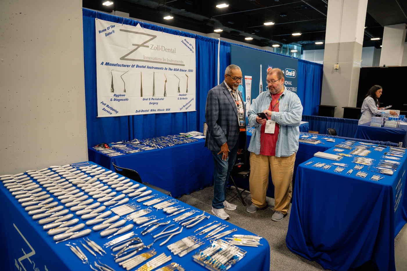 Exhibitor tables laid out with product literature and giveaways